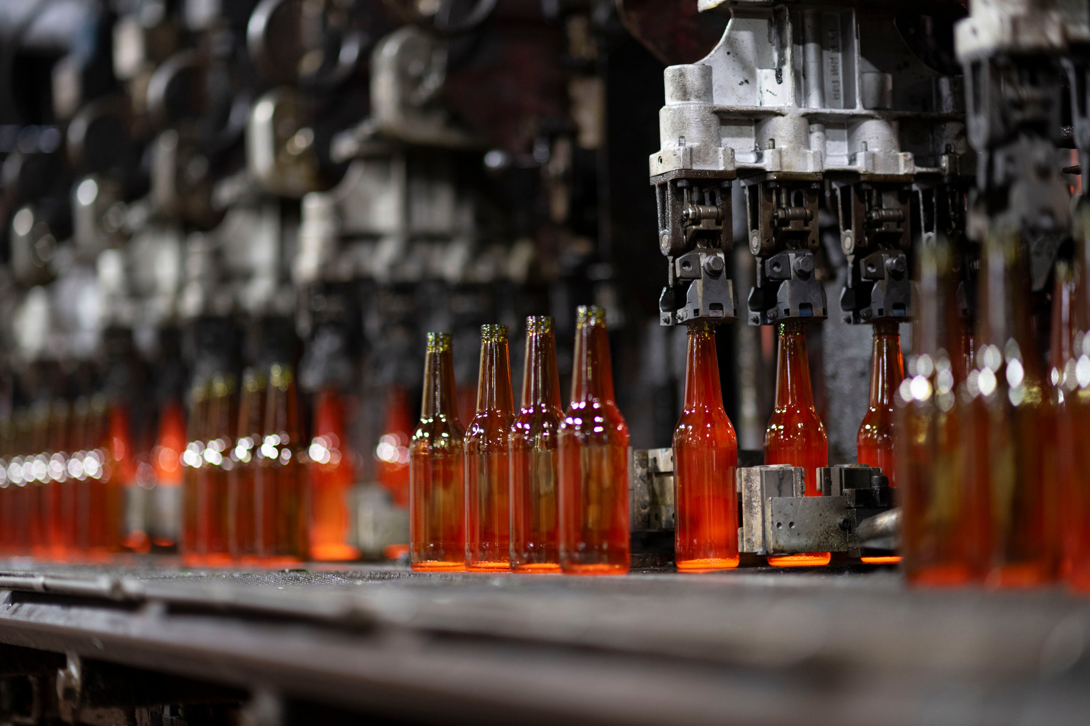 Amber glass bottles on the manufacturing line