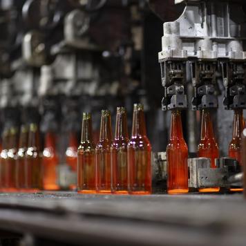Amber glass bottles on the manufacturing line