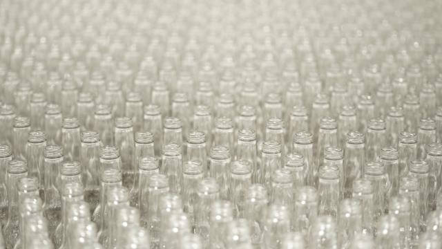 Hundreds of clear glass bottles