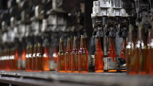Amber glass bottles on the manufacturing line