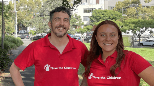 Male and Female both wearing a red t-shirt with the Save The Children logo