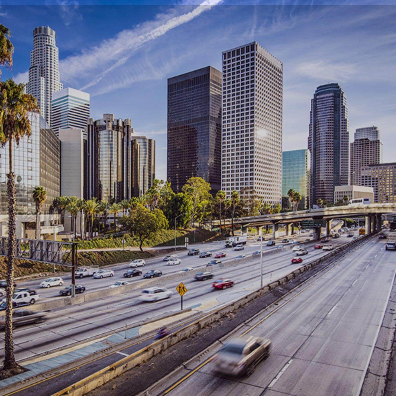 Image of highway in USA with buildings and palm trees