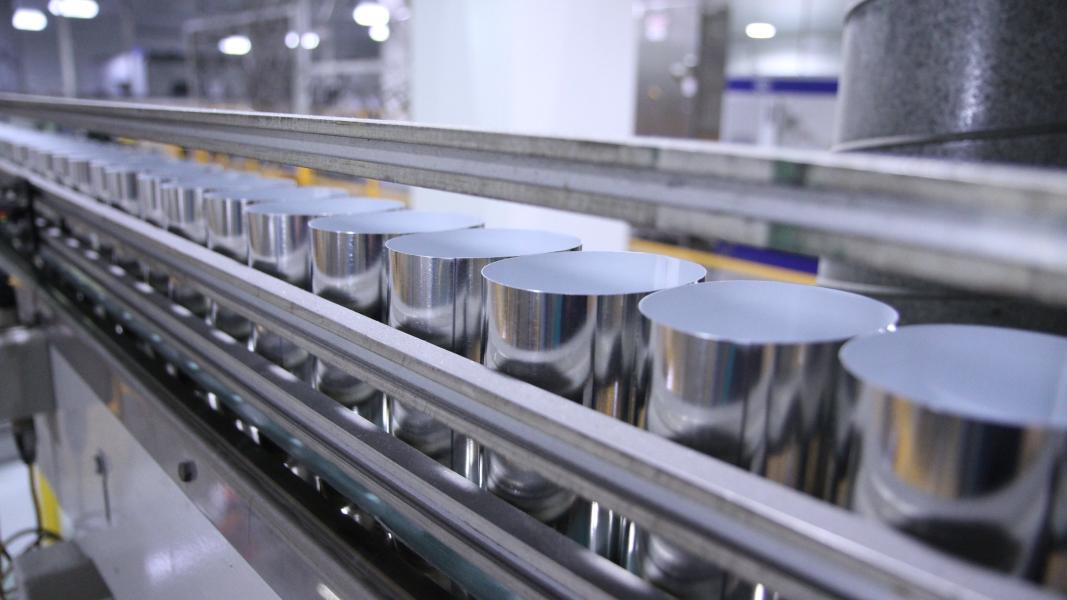 A row of aluminium cans in a manufacturing facility