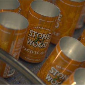 Burnt orange beverage cans with Stone & Wood written on them