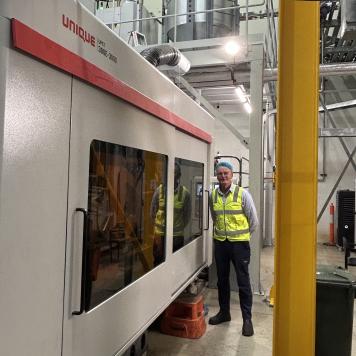Jon wears high-vis vest and PPE and stands at Visy's plastic site in Forrestfield, Western Australia.